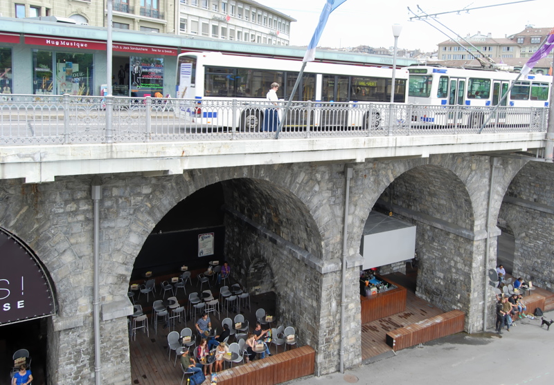 17 - The Grand-Pont bridge in Lausanne, Switzerland, with the Les Arches bar located under its stone arches at Place de l'Europe